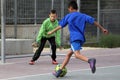 Children play football in the schoolyard