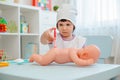 Children play in the hospital. The girl is dressed in a doctor 4 years old makes an injection to a boy 6 years old with Royalty Free Stock Photo