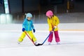 Children play ice hockey. Kids winter sport. Royalty Free Stock Photo