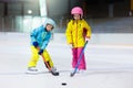 Children play ice hockey. Kids winter sport Royalty Free Stock Photo