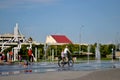 Children play with jets of a fountain on a hot sunny afternoon in the park of the 50th anniversary of JSC AvtoVAZ. Royalty Free Stock Photo