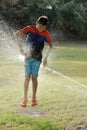 Children play with jets of water Royalty Free Stock Photo