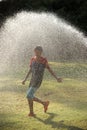 Children play with jets of water Royalty Free Stock Photo