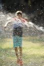 Children play with jets of water Royalty Free Stock Photo