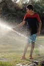 Children play with jets of water Royalty Free Stock Photo