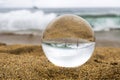 Children Play in Large Surf at Beach in Glass Ball