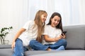 Children play with a mobile phone at home Royalty Free Stock Photo