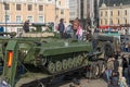 Children play on modern russian armored vehicle.