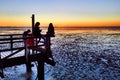 Children at play, mudflats, sunset Royalty Free Stock Photo