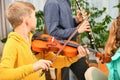 Children play musical instruments, violin and clarinet, accompanied by each other Royalty Free Stock Photo