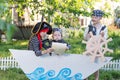 children play pirates at backyard Royalty Free Stock Photo