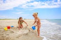 Children play with sand on beach Royalty Free Stock Photo