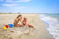 Children play with sand on beach Royalty Free Stock Photo