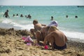 Children play on the sand on the beach. Royalty Free Stock Photo