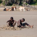 Children play in the sand at Second Beach, Port St Johns on the wild coast in Transkei, South Africa.