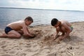 Children play on sandy beach of Lake Seliger Royalty Free Stock Photo