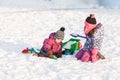 Children play on the snow Royalty Free Stock Photo