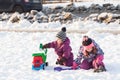 Children play on the snow Royalty Free Stock Photo