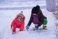 Children play with snow