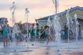 Children play and splash in the city`s fountains in the square. Editorial. 08.03.2017