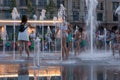 Children play and splash in the city`s fountains in the square. Editorial. 08.03.2017