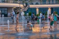 Children play and splash in the city`s fountains in the square. Editorial. 08.03.2017