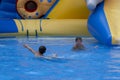 Children play and swim in pool. Two children are having fun in pool. Friends splashing in pool having fun leisure time. Summer Royalty Free Stock Photo