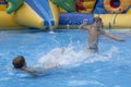 Children play and swim in pool. Two children are having fun in pool. Friends splashing in pool having fun leisure time. Summer Royalty Free Stock Photo