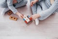 Children play with a toy designer on the floor of the children`s room. Two kids playing with colorful blocks Royalty Free Stock Photo