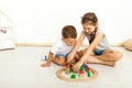 Cute little girl and boy playing with toys by the home Royalty Free Stock Photo