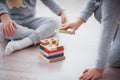 Children play with a toy designer on the floor of the children`s room. Two kids playing with colorful blocks Royalty Free Stock Photo