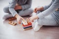 Children play with a toy designer on the floor of the children`s room. Two kids playing with colorful blocks Royalty Free Stock Photo