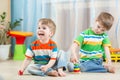 Children play with toys indoor Royalty Free Stock Photo