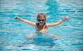 Children play in tropical resort. Family beach vacation. Child in summer swimming pool. Kids learn to swim. Royalty Free Stock Photo