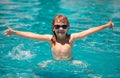 Children play in tropical resort. Family beach vacation. Kid boy swim in swimming pool. Kids learn to swim. Child Royalty Free Stock Photo