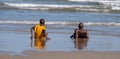 Children play in the waves at Second Beach, Port St Johns on the wild coast in Transkei, South Africa.