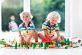 Children play wiht toy train. Kids wooden railway. Royalty Free Stock Photo