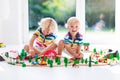 Children play wiht toy train. Kids wooden railway. Royalty Free Stock Photo