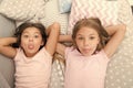 Children playful cheerful mood having fun together. Pajama party and friendship. Sisters happy small kids relaxing in Royalty Free Stock Photo