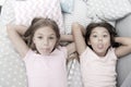 Children playful cheerful mood having fun together. Pajama party and friendship. Sisters happy small kids relaxing in Royalty Free Stock Photo