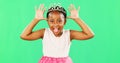 Children, playful and princess with a black girl on a green screen background in studio feeling silly or goofy. Kids Royalty Free Stock Photo