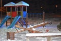 Children playground covered in snow