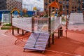 Children playground next to houses closed for quarantine due to the coronavirus epidemic Royalty Free Stock Photo