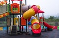 Children playground with plastic slide.