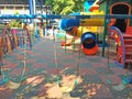 Children Playground in School under Big Tree in Sunny Day
