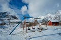 Children playground in winter. A village, Lofoten islands, Norway Royalty Free Stock Photo