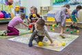 Children playing active games in the kindergarten.