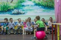 Children playing active games in the kindergarten.