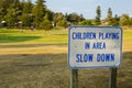 `Children playing in area slow down` for warning drive slowly.