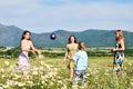 Children playing a ball in fiels